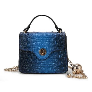 A blue crocodile-embossed mini satchel with a gold-tone turn-lock closure, top handle, and a chain strap featuring decorative gold spheres.