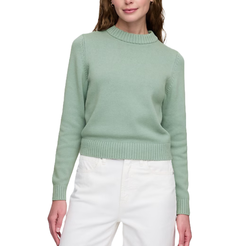Mint green high-neck crewneck sweater with ribbed cuffs and hem, paired with white pants.
