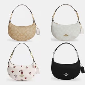 Four different colored shoulder bags with a signature brand pattern, one with a floral design.