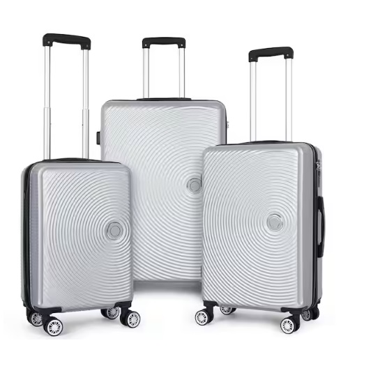 Three silver hard-shell suitcases with circular pattern designs, featuring telescopic handles and four double-spinner wheels.
