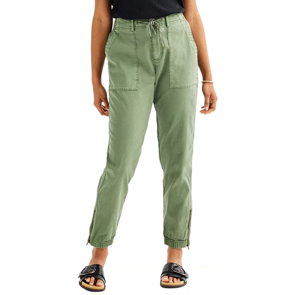 Green jogger pants with patch pockets, elastic cuffs, and adjustable drawstring waist, paired with black slide sandals.