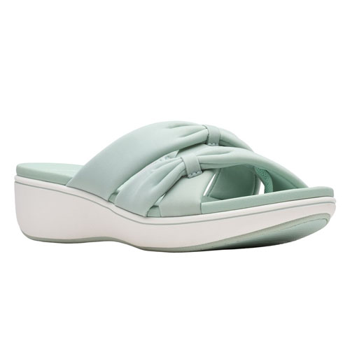 A light green slide sandal with a crisscross strap design and a thick white sole.