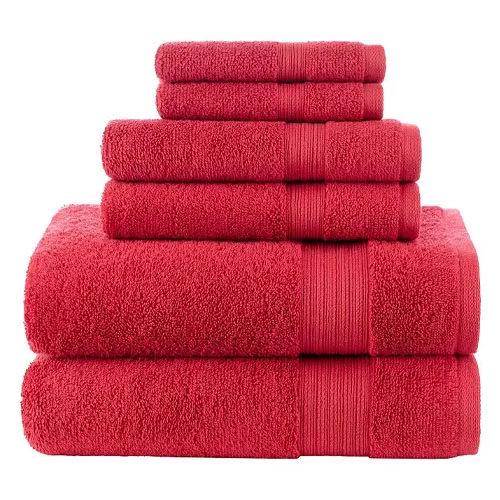 A stacked set of red towels in various sizes, including large bath towels at the bottom and smaller hand towels on top.