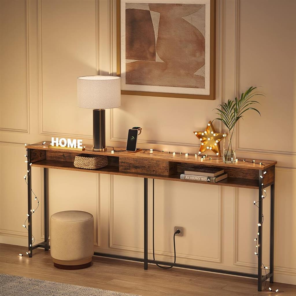 A console table with a tabletop lamp, star-shaped light decor, string lights, a basket, books, and a plant, with a round stool nearby.