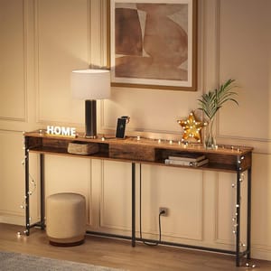 A console table with a tabletop lamp, star-shaped light decor, string lights, a basket, books, and a plant, with a round stool nearby.