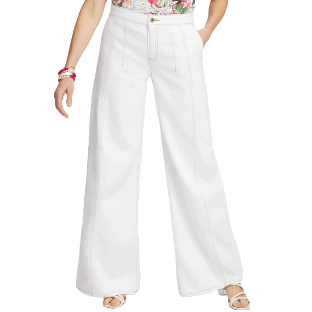 High-waisted, wide-leg white pants with visible stitching, worn with strappy sandals and a floral top.