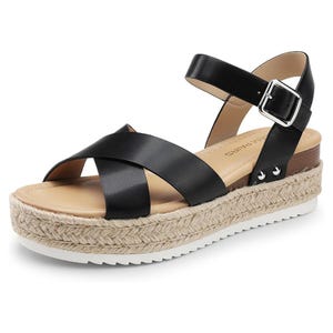A black platform sandal featuring crisscross leather straps, an ankle buckle, and a braided jute sole.