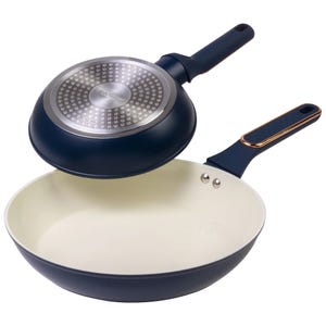 Two-piece nonstick cookware set featuring a deep fry pan with a lid and a shallow pan with a long handle, both in navy blue with cream interiors.