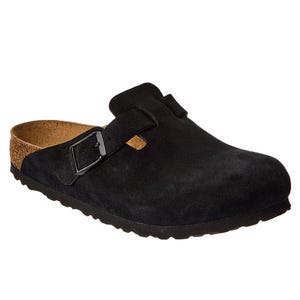 A black suede clog with a buckle strap and a cork footbed, featuring a rubber sole for comfort and support.
