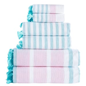 A stack of towels with blue and pink stripes and tassels.