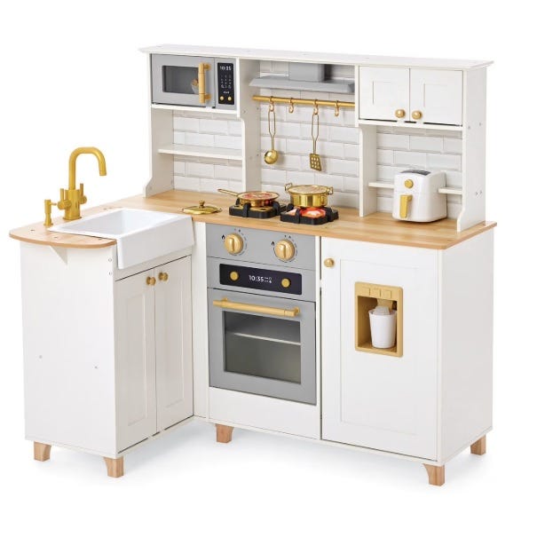 A children's play kitchen set featuring a white and gold design, complete with a sink, stove, oven, microwave, and shelves for accessories.