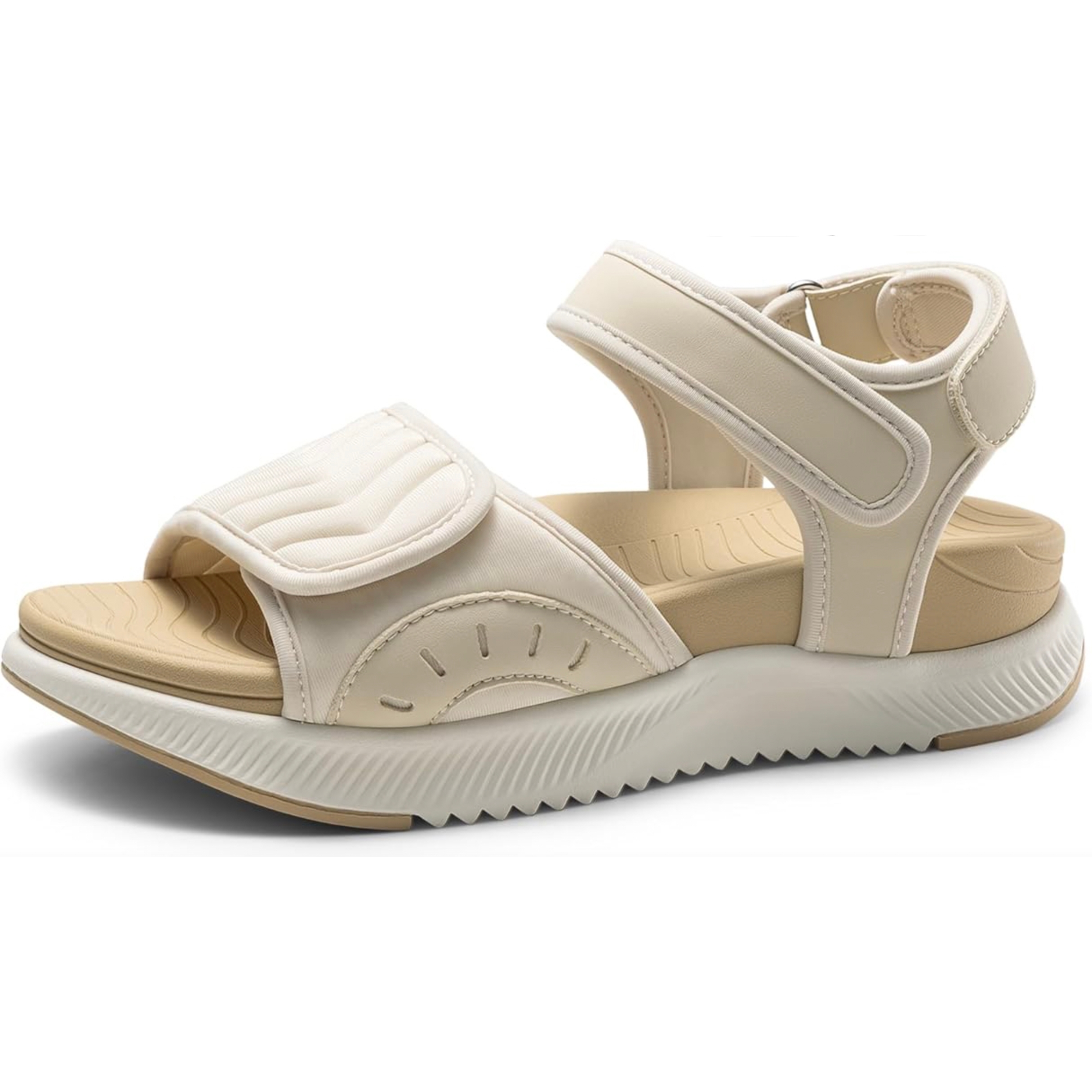 A beige sandal with adjustable velcro straps, cushioned footbed, and a textured sole.