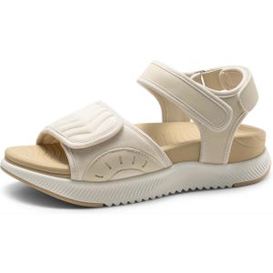 A beige sandal with adjustable velcro straps, cushioned footbed, and a textured sole.