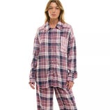 A model wears a long-sleeve plaid button-up shirt and matching pants in shades of red, purple, and white.