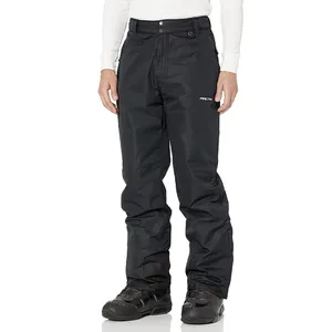 Black snow pants with a logo on the right thigh, worn with black winter boots.