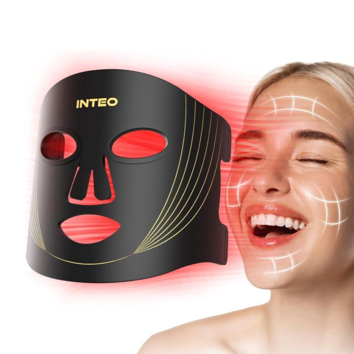 A black and gold LED face mask emits red light, likely used for skincare and anti-aging. A smiling woman's face is shown with overlayed lines suggesting areas of effect on her skin.