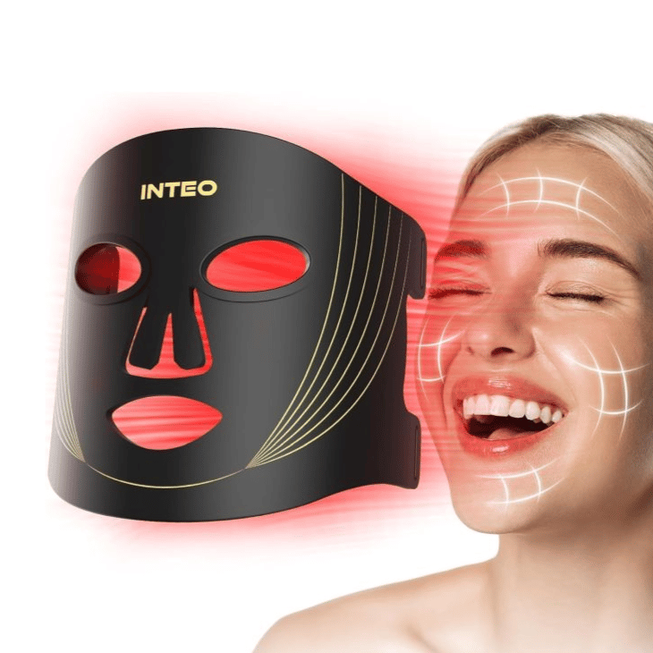 A black and gold LED face mask emits red light, likely used for skincare and anti-aging. A smiling woman's face is shown with overlayed lines suggesting areas of effect on her skin.