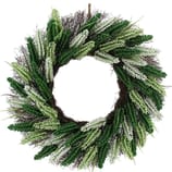 A decorative wreath featuring a mix of green and white artificial foliage arranged in a circular pattern.