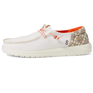 Hey Dude Wendy Funk Shoes feature a white upper with orange accents, woven heel detail, and a cushioned sole for comfort. They have coral-colored bungee laces and a colorful stitched logo, designed for casual style and ease of wear.