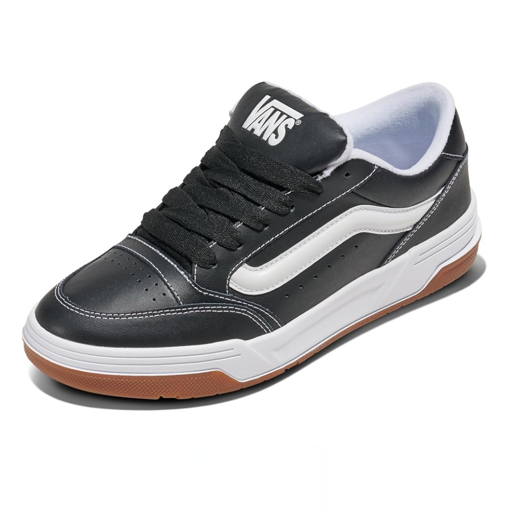 A black Vans sneaker with a white stripe, gum sole, and white midsole. Features a perforated toe box and a padded collar for comfort.