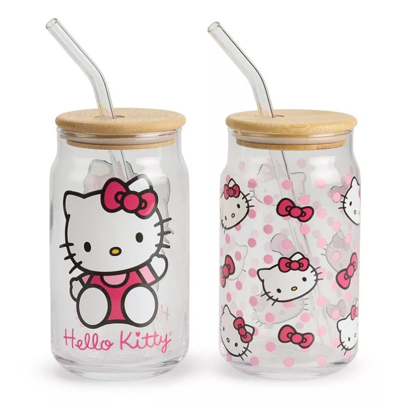 The 2pk Hello Kitty Glass Tumbler set features two glass tumblers with bamboo lids and glass straws. One tumbler showcases a large Hello Kitty design, while the other has a pattern of smaller Hello Kitty faces and pink dots.