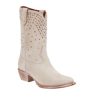 Frye Sacha Boots are stylish cream-colored leather boots with stud detailing along the upper section and a classic Western design, featuring a slightly pointed toe and a wooden block heel.