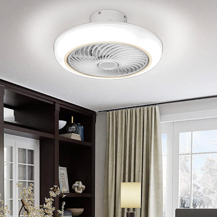 A ceiling fan with an integrated LED light fixture is installed in a living room, providing both illumination and air circulation.