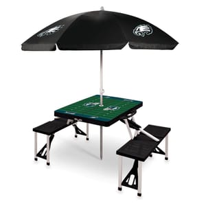 Folding picnic table with attached benches, featuring a football field design and black umbrella with eagle logos.