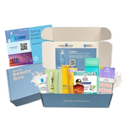 Walmart Beauty Box containing La Roche-Posay Toleriane Cleanser, OGX shampoo, Curel lotion, Tangle Teezer, KISS false nails, and assorted samples.