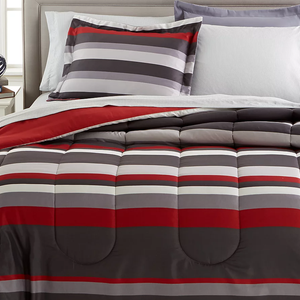 A striped bedding set featuring shades of gray, red, and white, including a comforter and pillowcases.