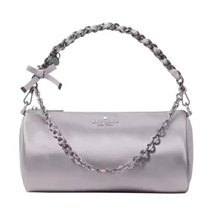 A metallic silver Kate Spade New York barrel bag featuring a chain strap and a small bow accent.
