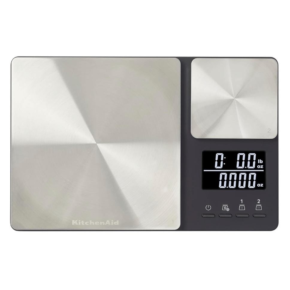 A dual-platform digital kitchen scale with a sleek stainless steel design, featuring a digital LCD display and buttons for unit conversion and tare function.