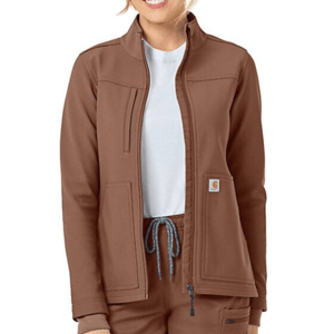 Brown Carhartt Rugged Flex Jacket with a zip-up front, high collar, two large front pockets, and a small Carhartt logo patch on the left pocket. The wearer is styled with matching pants and a white undershirt.