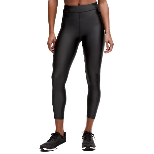 Black high-waisted leggings with a shiny, leather-like finish, paired with black athletic shoes.