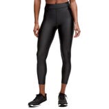Black high-waisted leggings with a shiny, leather-like finish, paired with black athletic shoes.