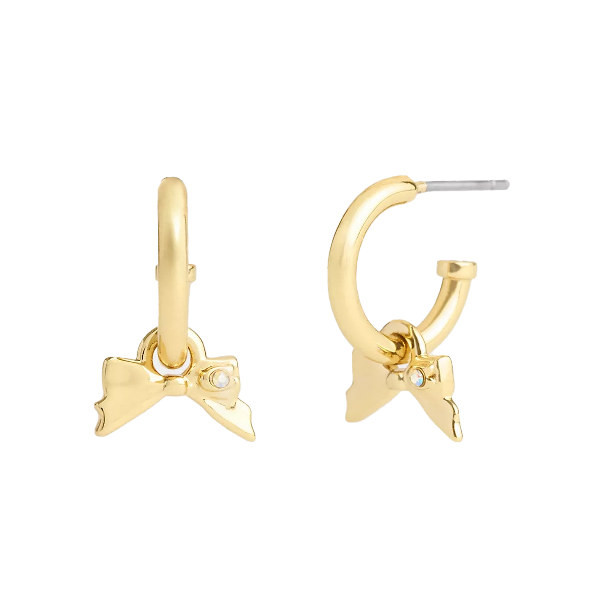 Gold-tone huggie earrings featuring a small bow charm with a tiny gemstone accent.