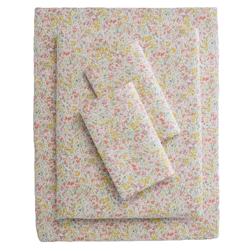 A set of floral-patterned bed sheets featuring pink, yellow, and light green hues, displayed with multiple folded layers.