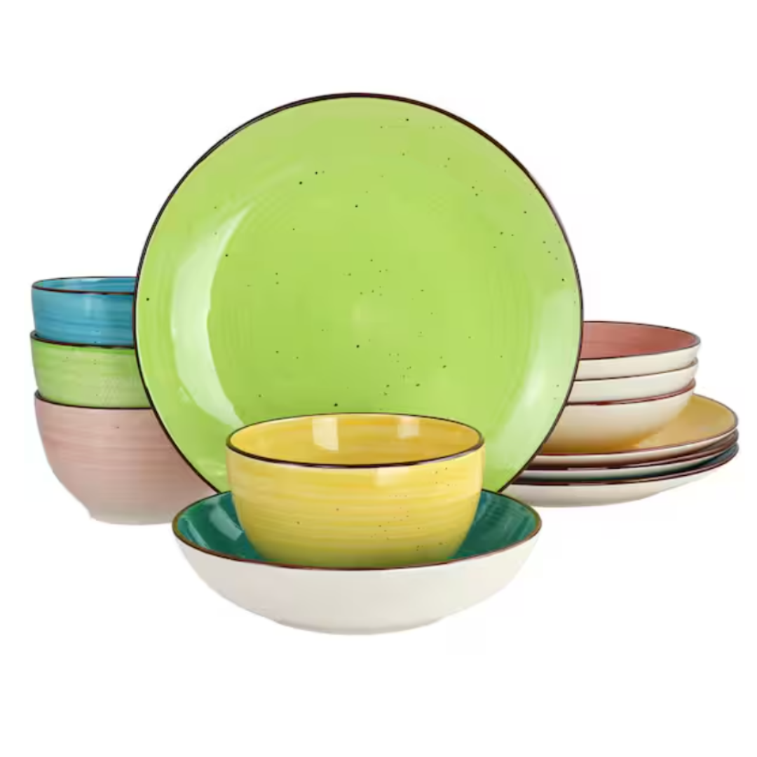 16-piece dinnerware set includes a variety of dishes in vibrant colors: light green, yellow, blue, pink, and white. The set features plates, bowls, and cereal bowls with a speckled design and dark rim accents.