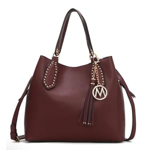 Rich brown shoulder bag featuring gold stud accents on the handles, a decorative gold chain with tassel, and a round \“M\“ charm. Equipped with adjustable strap, suitable for versatile use.