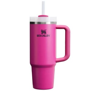 Pink Stanley tumbler with handle and straw.