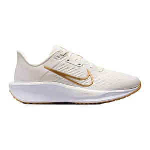 A single white athletic shoe with a gold Nike swoosh, featuring a ComfiRide sole and light brown outsole.