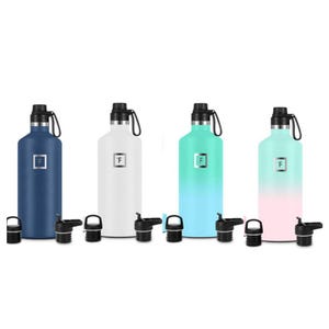 Four reusable water bottles in navy, white, teal, and ombré pink-teal with additional caps.