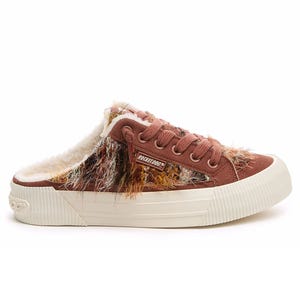 A brown slip-on sneaker with a fuzzy, multicolored fabric design and a cream-colored sole, featuring fur lining for added warmth.