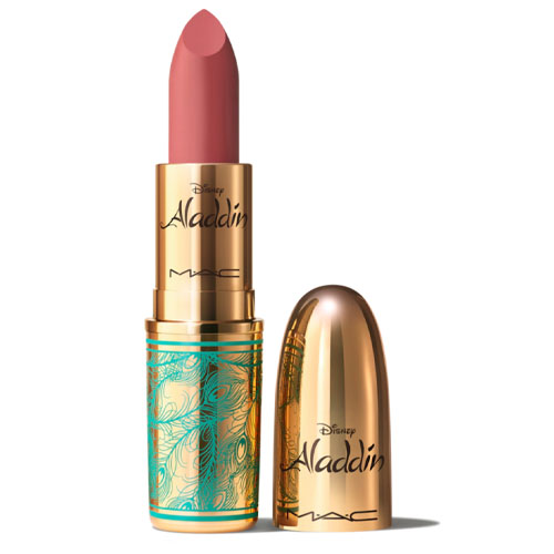 MAC x Disney Aladdin lipstick features a gold and turquoise tube with an intricate design. The lipstick itself is a muted pink shade, and the packaging displays the Aladdin and MAC logos.