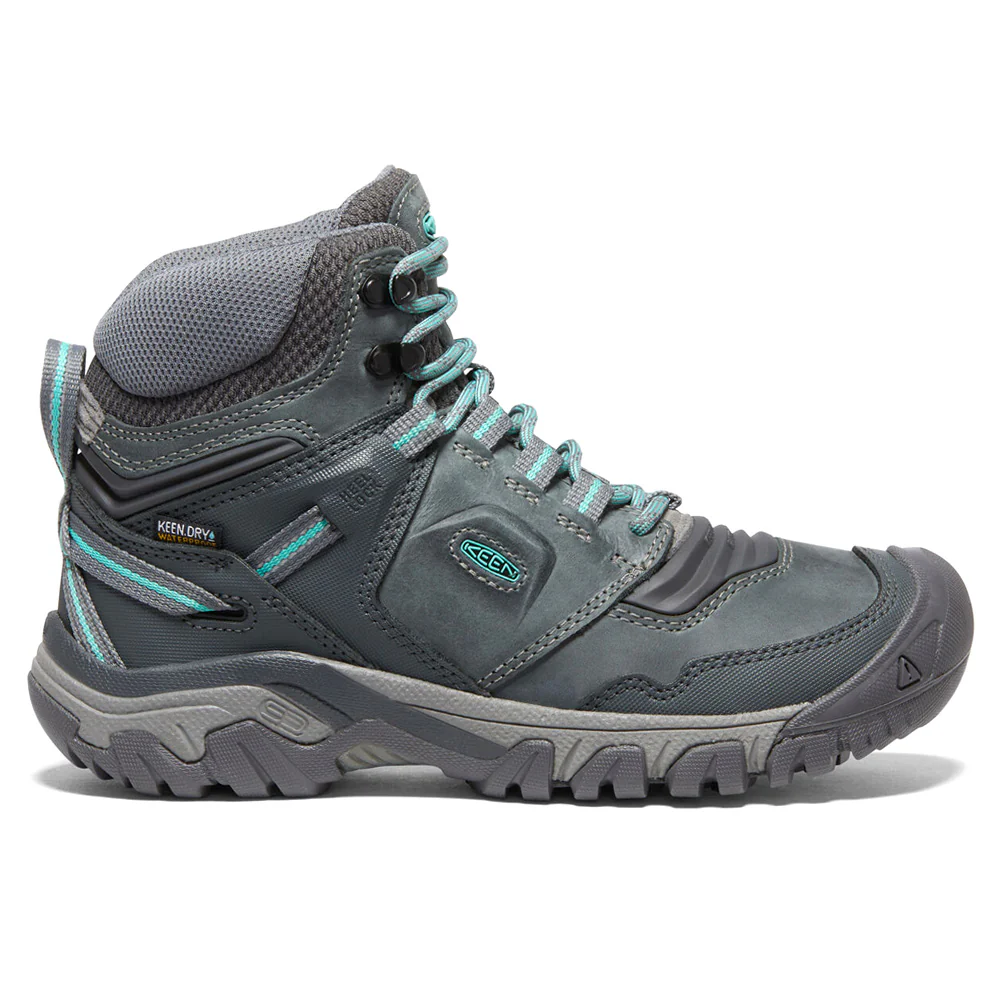 Keen Ridge Flex Hiking Boots in gray feature a rugged design with a sturdy sole, blue accents, and a high ankle collar for support, including waterproof and breathable materials.