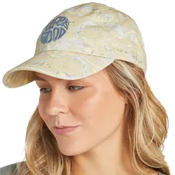 A woman wears a light-colored patterned baseball cap with \“Life is Good\“ embroidered on the front.