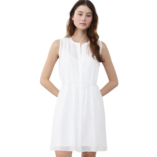 Sleeveless white mini dress with a subtle A-line silhouette, featuring a round collar, buttoned top, fine pleating on the bodice, and a cinched waist with a thin tie belt.