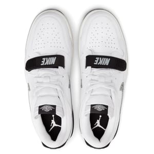 A pair of white Air Jordan shoes with black accents and the Jumpman logo on the tongue.