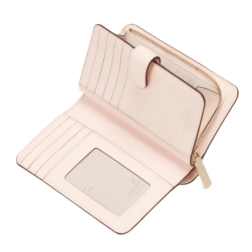 The Kate Spade Lena Medium Bifold Wallet is a light pink wallet featuring multiple card slots, an ID window, and a zippered coin compartment, secured with a snap closure.