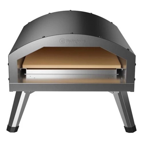 The oven is a compact, dome-shaped electric pizza oven with metallic legs and a visible stone baking surface. It features the Westinghouse logo on the front. Designed for indoor or outdoor use.